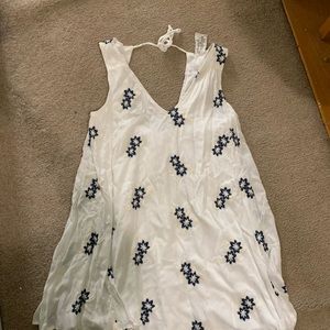 White tank dress with blue embroidered flowers